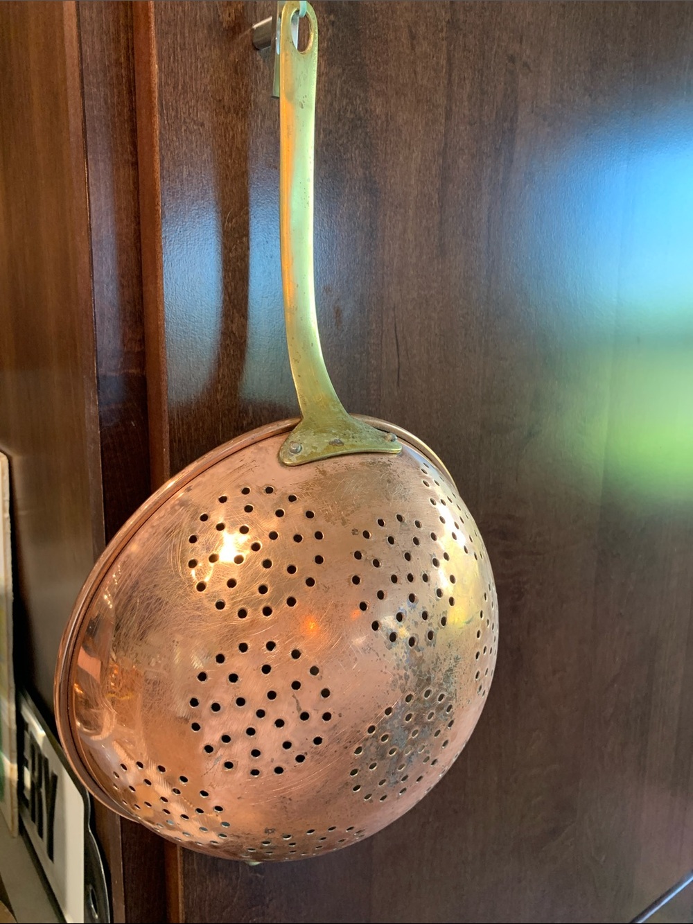 vintage copper colander strainer with a long brass handle 16”L